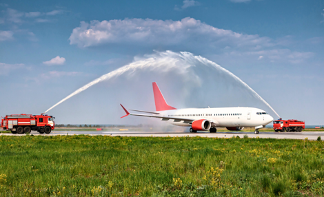 An inaugural flight receving a water salute at an airport as part of an air service development success