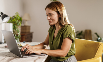 Woman using laptop when working from home office.jpg