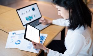 Woman_Analyzing_Charts.jpg