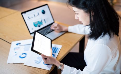 Woman_Analyzing_Charts.jpg