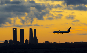 Plane landing in Madrid - 4 torres in background.png