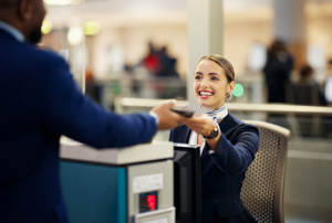 Airport service agent helping a passenger