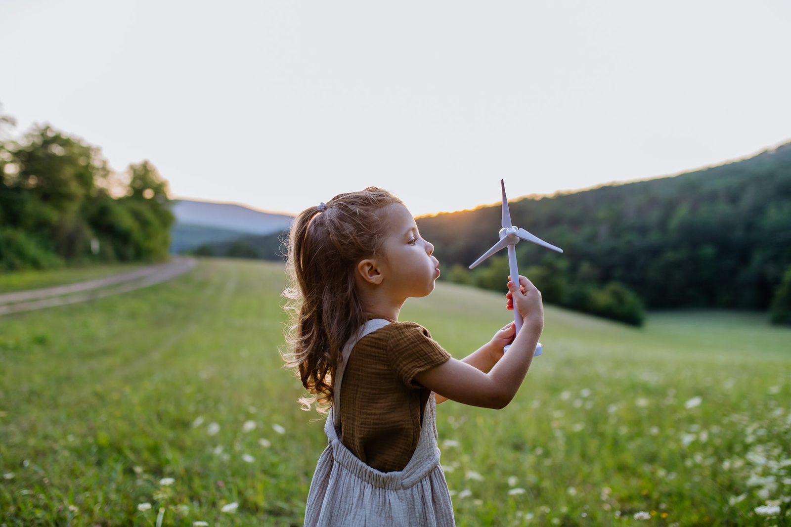 web_little-girl-standing-nature-model-wind_Credit_Halfpoint_shutterstock_2193414283.jpg