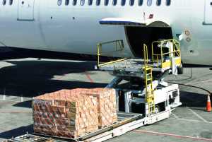 Freighter aircraft being loaded with air cargo.jpg