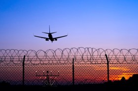 Airplane approaching runway in the dark.jpeg