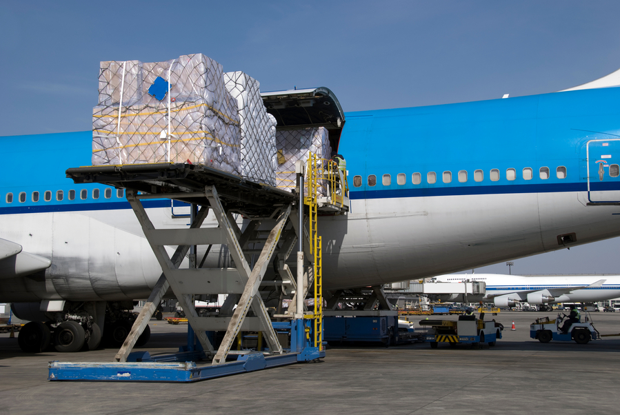 Freighter aircraft being loaded with cargo shipments.jpg