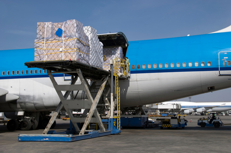 Freighter aircraft being loaded with cargo shipments.jpg