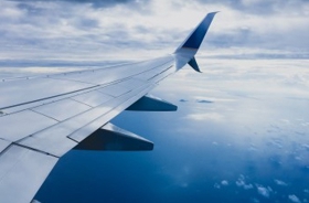 Aircraft wing blue sky