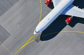 Aircraft on runway with yellow lines