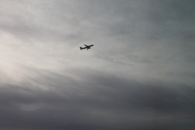 aircraft ascending in gray sky