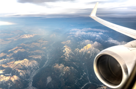 aircraft flying over mountains