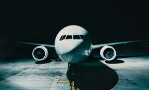 Aircraft on tarmac at night