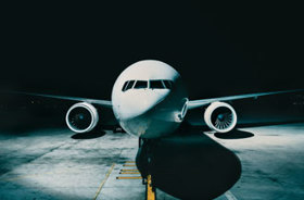 Aircraft on tarmac at night