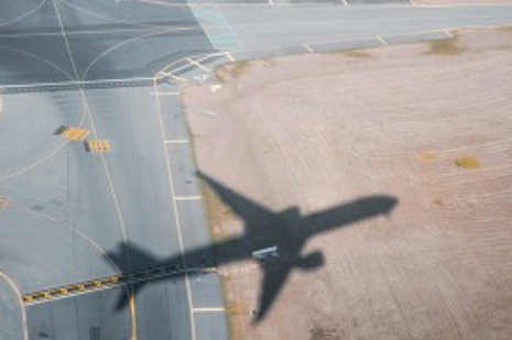 Aircraft shadow over runway
