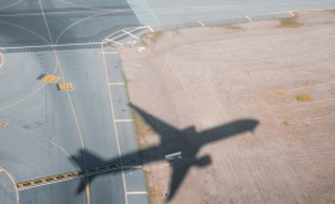 Aircraft shadow over runway