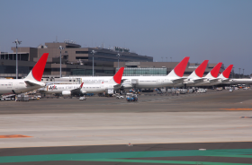 Several aircraft parked on runway